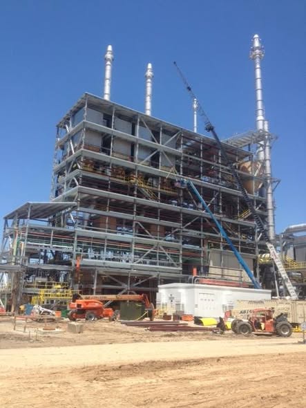 Multi-level structural steel structure under construction at an industrial plant